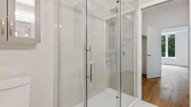 clear glass door with white steel frame